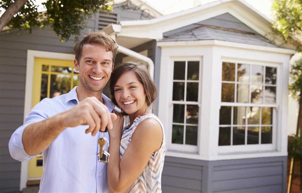 Couple Holding Keys to New Home Broadview Homes